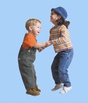 2 kids at Achieve Pediatric Therapy in Orlando holding hands during an exercise.